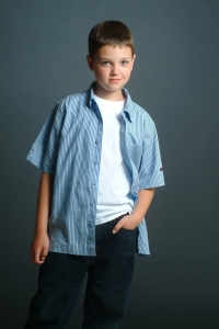 Photograph of a young boy with a blue shirt